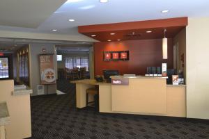 a lobby of a restaurant with a counter and chairs at TownePlace Suites by Marriott Williamsport in Williamsport