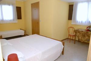 Postel nebo postele na pokoji v ubytování Hotel Rosa Dei Venti