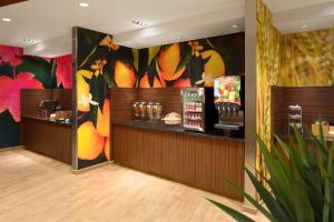 a restaurant with a bar with a colorful wall at Fairfield Inn & Suites by Marriott Bristol in Bristol