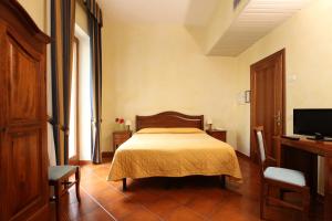 Postel nebo postele na pokoji v ubytování Hotel Bologna