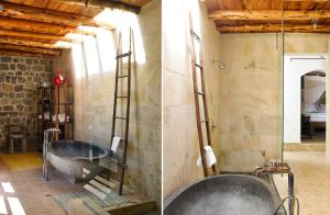 a bathroom with a tub and a glass shower at Kasbah 3 in Cala Vadella