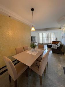 a dining room with a table and chairs at Ap Beira mar na Orla in Aracaju