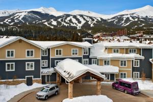 a group of houses with snow on the roofs at Residence Inn by Marriott Breckenridge in Breckenridge