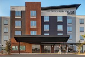 a rendering of the front of the tower hotel suites at TownePlace Suites by Marriott Phoenix Glendale Sports & Entertainment District in Glendale