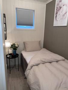 Postel nebo postele na pokoji v ubytování Moderne og sentral leilighet med koselig og privat uteplass! + 10 fotografií