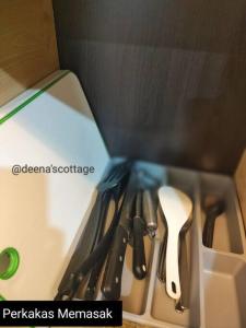 a drawer with utensils in a box at Deena's Cottage Kulim Hitech Hospital Kulim, Three-bedrooms Single Storey Terrace House in Kulim