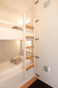 a room with bunk beds and a closet at Wohnung Bontje in Juist