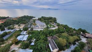 an aerial view of a resort near the water at the andromeda condominium seaview in Pattaya South