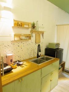 a kitchen with a sink and a counter top at Migo Housing 1 - Beer Street - Old Quarter in Hanoi