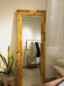 a hallway with a wooden mirror in a room at Migo Housing 1 - Beer Street - Old Quarter in Hanoi