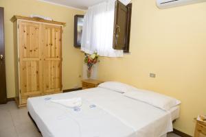 Postel nebo postele na pokoji v ubytování Hotel Rosa Dei Venti