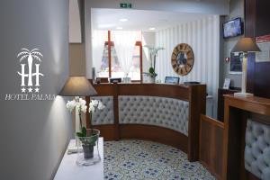 a hotel room with a bed and a table with flowers at Hotel Palma in Castellammare di Stabia