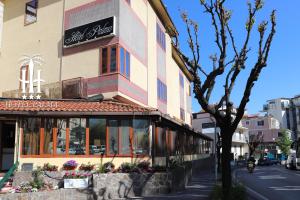 a building with a sign on the side of it at Hotel Palma in Castellammare di Stabia