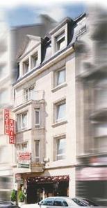 a tall white building with a car in front of it at Hotel Zurich in Luxembourg