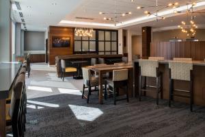 a dining room with a table and chairs at TownePlace Suites by Marriott Saskatoon in Saskatoon