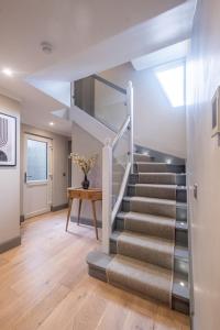 a staircase in a house with a skylight at The Arran, St Andrews in St. Andrews