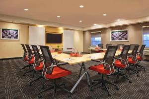 a conference room with a long table and chairs at TownePlace Suites by Marriott London in London