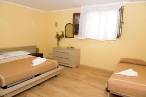 Postel nebo postele na pokoji v ubytování Hotel Rosa Dei Venti