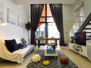 a living room with a couch and a table at EkoCheras Loft 5 pax, #Snooker #AboveMall #Balcony #FreeCarPark in Kuala Lumpur