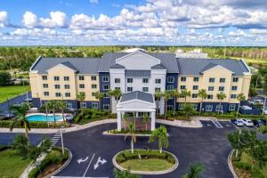 an aerial view of a hotel with a parking lot at Fairfield Inn and Suites by Marriott Naples in Naples