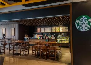 a restaurant with tables and chairs and a bar at EkoCheras Loft 5 pax, #Snooker #AboveMall #Balcony #FreeCarPark in Kuala Lumpur