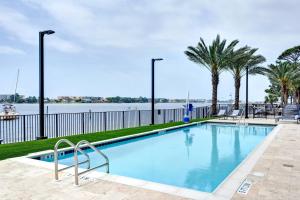 a swimming pool with a view of the water at Residence Inn by Marriott Fort Walton Beach in Fort Walton Beach