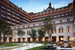 a large building with a courtyard in front of it at The Ritz-Carlton, Tianjin in Tianjin