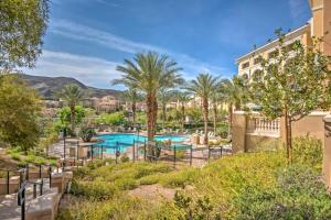 a resort with a pool and palm trees at Henderson Vacation Rental with Balcony! in Las Vegas