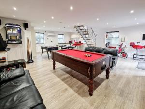 a living room with a pool table in it at The Lodge in Skipwith