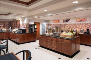 a large kitchen with a counter with food on it at Fairfield Inn & Suites Tucson North/Oro Valley in Oro Valley