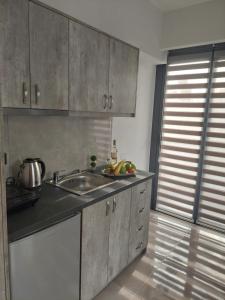 מטבח או מטבחון ב-Luana Monte Apartments