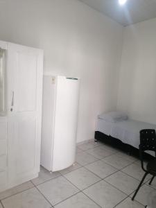 Katil atau katil-katil dalam bilik di Quarto para Rapazes no Centro Sinop MT