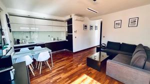 a living room with a couch and a table and a kitchen at Aqua Villa 4 in Jurata +18 photos