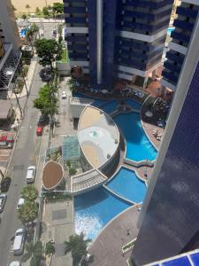 an aerial view of a swimming pool in a city at Beach Class Fortaleza by AM in Fortaleza