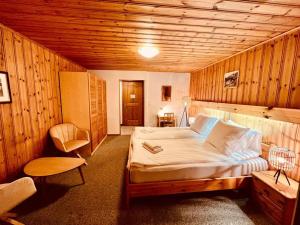 Rúm í herbergi á Rooms with Private bathrooms