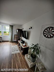 a living room with a dart board on the wall at Agroturystyka Karbowo in Brodnica