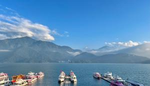a group of boats in a large body of water at 沛青日旅民宿 PQ Room in Yuchi