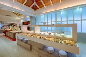 a bakery with donuts on display in a building at Grand Sirenis Punta Cana Resort & Aquagames - All Inclusive in Punta Cana