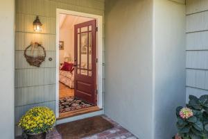 a door leading to a room with a couch at 3757 Garden House Sanctuary home in Carmel