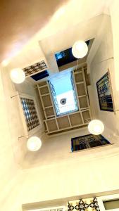 a ceiling with lights and windows in a room at Sant'Agostino Suites & Rooms in Mazara del Vallo