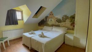 Postel nebo postele na pokoji v ubytování The Way Hotel Molinaseca