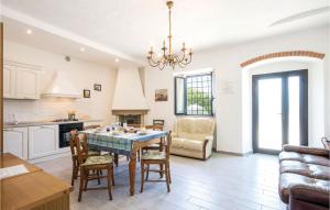 a kitchen and living room with a table and chairs at Casa Alice in Cireglio