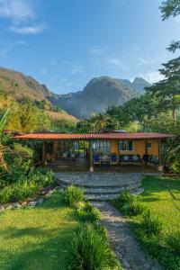 a house with a view of the mountains at Lake Front Retreat in Santa Cruz La Laguna