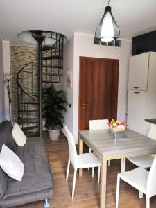 a kitchen and dining room with a table and chairs at Casa Vacanza "A Due Passi" in Paravati