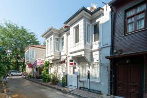 a row of houses on a city street at Begonville Corner in Istanbul