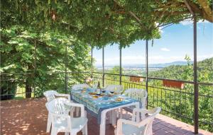 a table and chairs on a patio with a view at Casa Vanessa in Cireglio