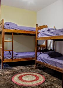 Buena Vibe Hostel客房内的一张或多张床位