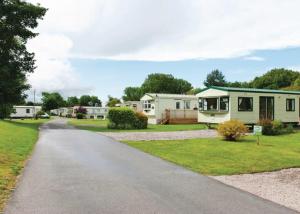 a road leading to a caravan park at Parc Farm Holiday Park in Mold