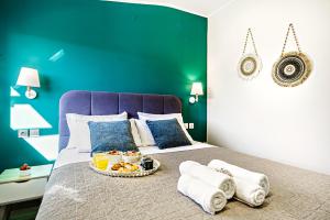 Postel nebo postele na pokoji v ubytování Ionian Citizen Penthouse