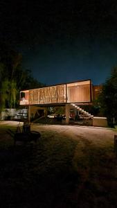 a building that is lit up at night at Casa Contenedor - Bermejo Mendoza in Guaymallen